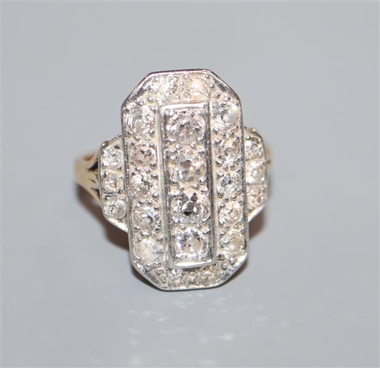 A mid 20th century Art Deco style yellow metal and plat, diamond cluster tablet ring, size K.